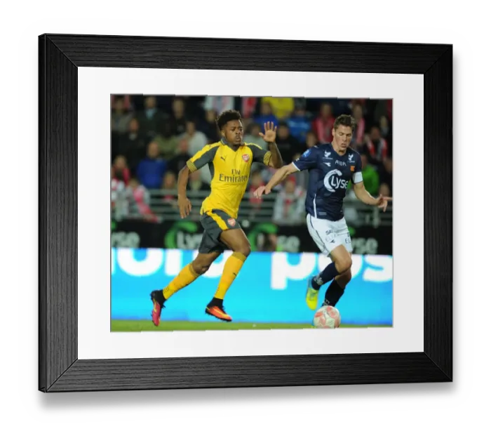 Framed Print : Arsenal's Chuba Akpom Goes Head-to-Head with Erik Steen in Viking Friendly Clash