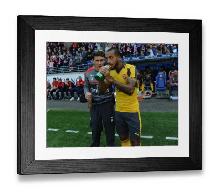 Framed Print : Arsenal's Theo Walcott and Doctor Gary O'Driscoll Before Viking FK Friendly