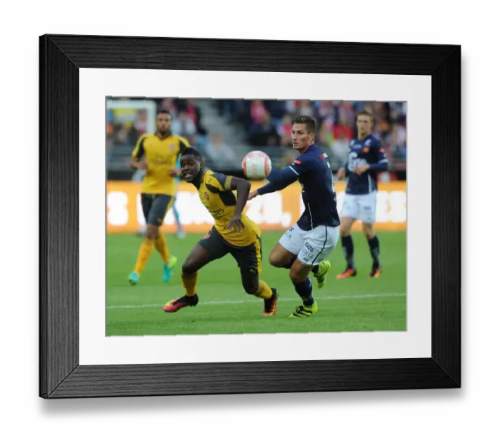 Framed Print : Clash of Stars: Joel Campbell vs. Kristoffer Haugen in Arsenal's Pre-Season Battle against Viking FK (2016)