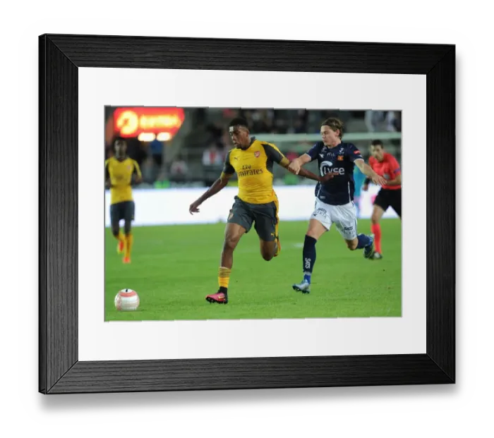 Framed Print : Arsenal's Alex Iwobi Goes Head-to-Head with Julian Ryerston in Viking FK Friendly Framed Print : Arsenal's Alex Iwobi Goes Head-to-Head with Julian Ryerston in Viking FK Friendly