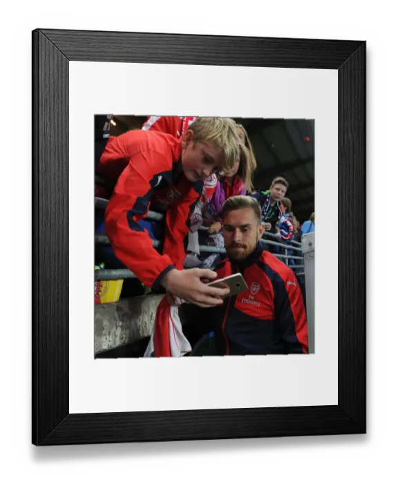 Framed Print : Aaron Ramsey Celebrates with Arsenal Fans after Winning against Viking FK in Norway