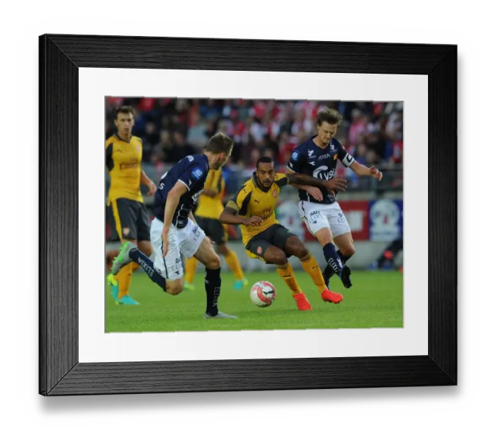 Framed Print : Theo Walcott vs. Andre Danielsen: A Clash in Pre-Season Friendly between Viking FK and Arsenal