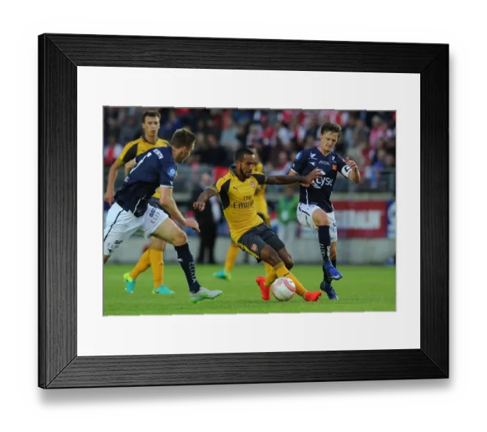 Framed Print : Theo Walcott vs. Andre Danielsen: A Pre-Season Clash at Viking Stadion Framed Print : Theo Walcott vs. Andre Danielsen: A Pre-Season Clash at Viking Stadion