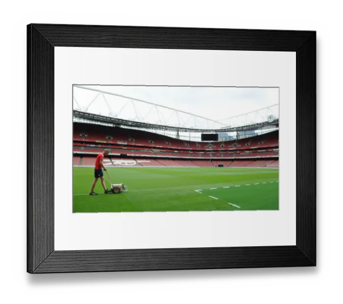 Framed Print : Preparing for the Arsenal-Liverpool Battle: Marking the Emirates Stadium Pitch for Premier League Clash, 2016-17