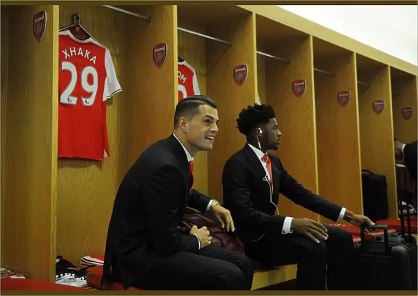 Arsenal Squad Unity: A Moment of Camaraderie - Xhaka and Akpom in the Changing Room before Arsenal vs Liverpool (2016-17)
