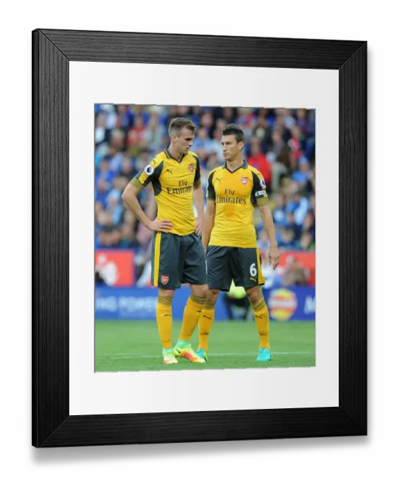 Framed Print : Arsenal's Holding and Koscielny in Action: Premier League 2016-17 - Leicester City vs Arsenal Framed Print : Arsenal's Holding and Koscielny in Action: Premier League 2016-17 - Leicester City vs Arsenal