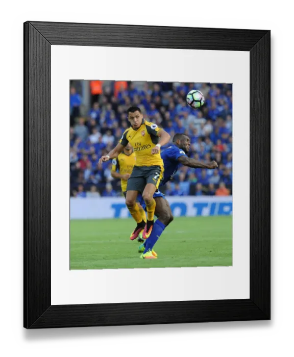 Framed Print : Clash of Titans: Sanchez vs Morgan - Arsenal vs Leicester City, Premier League 2016-17: A Battle of Strength and Skill Framed Print : Clash of Titans: Sanchez vs Morgan - Arsenal vs Leicester City, Premier League 2016-17: A Battle of Strength and Skill