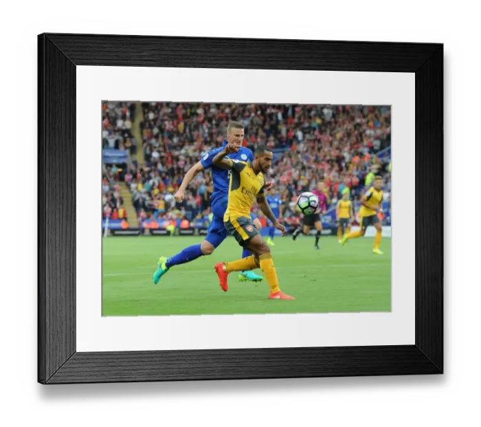 Framed Print : Theo Walcott vs. Robert Huth: A Footballing Battle at The King Power Stadium (2016-17)