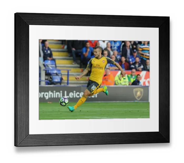 Framed Print : Jack Wilshere Goes Head-to-Head with Leicester City in Premier League Battle (2016-17) Framed Print : Jack Wilshere Goes Head-to-Head with Leicester City in Premier League Battle (2016-17)