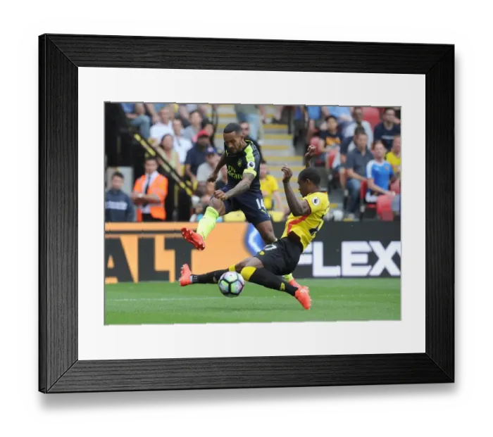 Framed Print : Theo Walcott vs Christian Kabasele: A Football Rivalry at Vicarage Road (Watford vs Arsenal 2016-17)