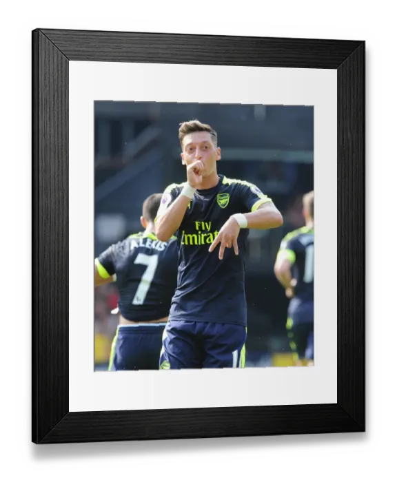 Framed Print : Mesut Ozil celebrates scoring Arsenals 3rd goal. Watford 1: 3 Arsenal. Premier League Framed Print : Mesut Ozil celebrates scoring Arsenals 3rd goal. Watford 1: 3 Arsenal. Premier League