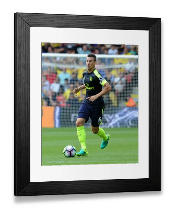 Framed Print : Laurent Koscielny (Arsenal). Watford 1: 3 Arsenal. Premier League. Vicarage Road, Watford