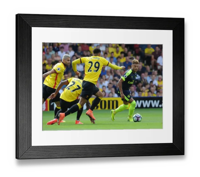 Framed Print : Oxlade-Chamberlain's Star Performance: Arsenal Triumphs 3-1 over Capoue and Watford in Premier League