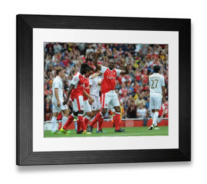 Framed Print : Arsenal Legends vs. AC Milan Glorie: Kanu's Epic Goal Celebration at Emirates Stadium Framed Print : Arsenal Legends vs. AC Milan Glorie: Kanu's Epic Goal Celebration at Emirates Stadium