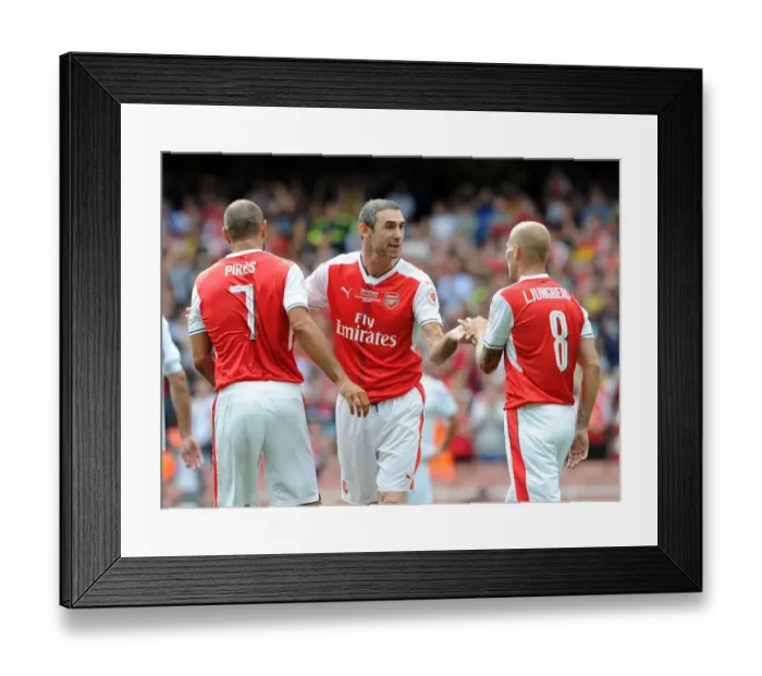 Framed Print : Arsenal Legends vs. AC Milan Glorie: A Reunion at Emirates - Pires Scores the Decisive Goal