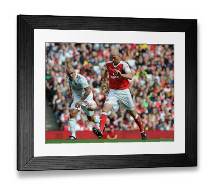 Framed Print : Arsenal Legends vs. Milan Glorie: A Battle of Football Legends at Emirates Stadium