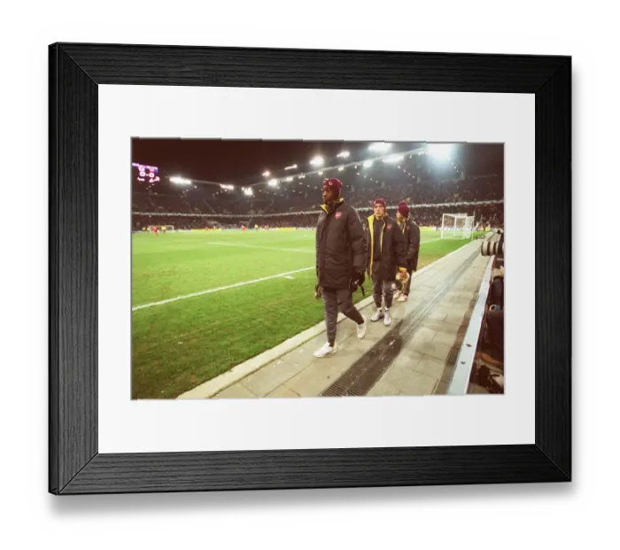 Framed Print : Johan Djourou, Arturo Lupoli and Cesc Fabregas (Arsenal) make their way to the substitutes bench aft