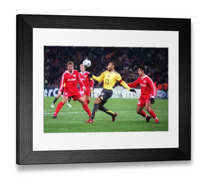 Framed Print : Thierry Henry (Arsenal) Selver Hodzic (Thun). FC Thun 0: 1 Arsenal