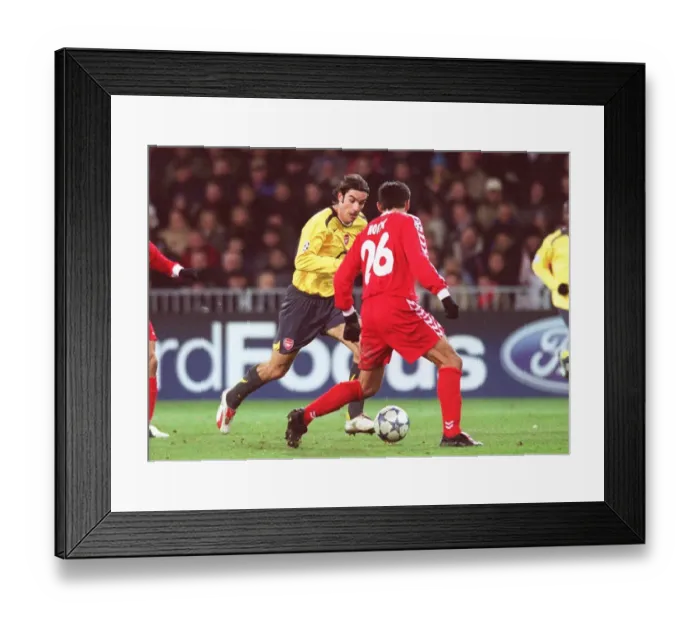 Framed Print : Robert Pires (Arsenal) Selver Hodzic (Thun). FC Thun 0: 1 Arsenal Framed Print : Robert Pires (Arsenal) Selver Hodzic (Thun). FC Thun 0: 1 Arsenal
