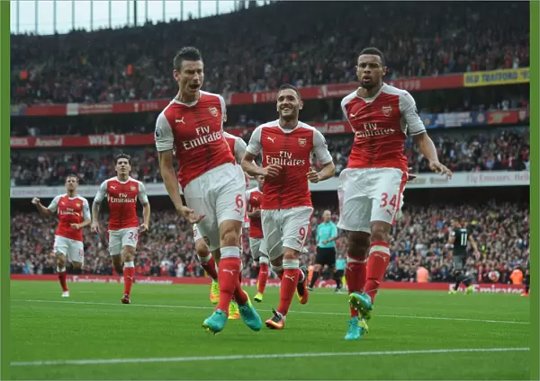 Arsenal's Koscielny and Coquelin: Celebrating a Goal Against Southampton (2016-17)