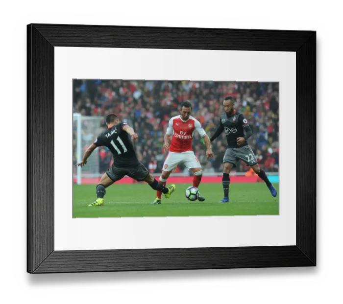 Framed Print : Arsenal vs Southampton: Cazorla vs Tadic and Redmond - Intense Clashes in the 2016-17 Premier League Showdown