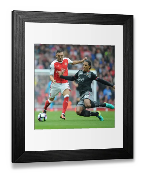Framed Print : Arsenal vs Southampton: Perez vs Van Dijk - Premier League Battle at Emirates Stadium