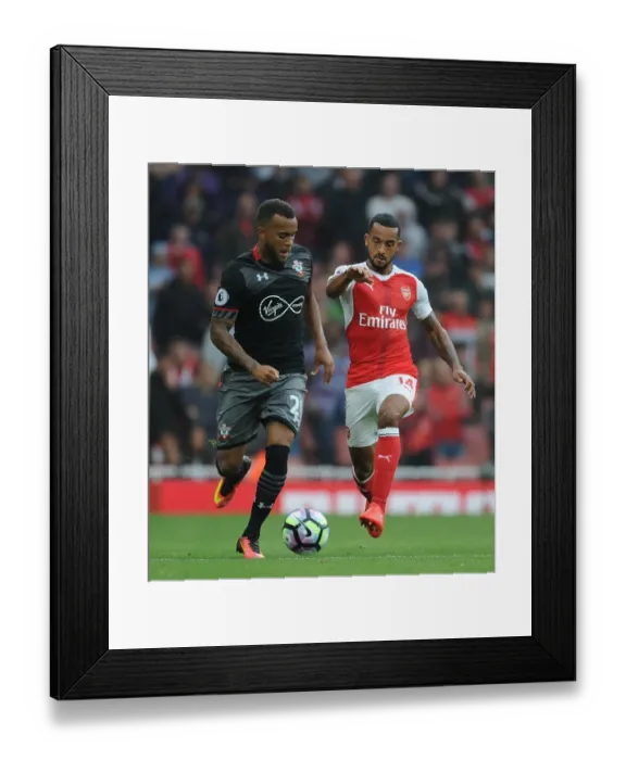 Framed Print : Arsenal vs Southampton: Walcott vs Bertrand - Premier League Battle at Emirates Stadium
