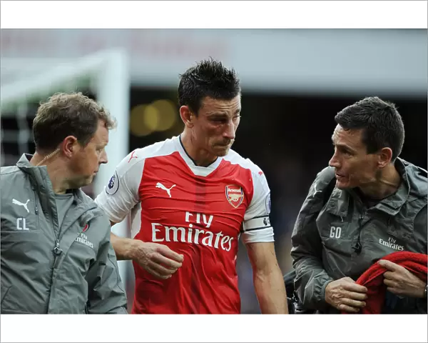 Arsenal's Koscielny Receives Medical Attention During Arsenal vs Southampton Match, 2016-17