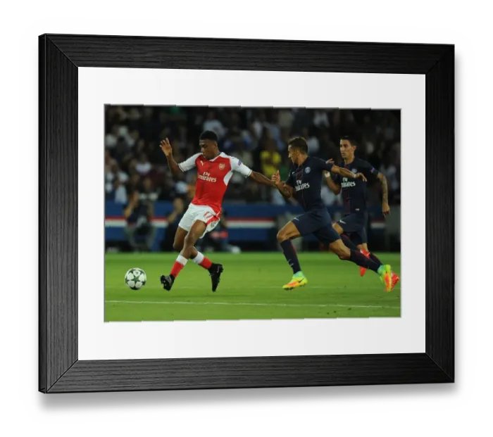 Framed Print : Arsenal's Alex Iwobi Overpowers Marquinhos in Champions League Clash Framed Print : Arsenal's Alex Iwobi Overpowers Marquinhos in Champions League Clash