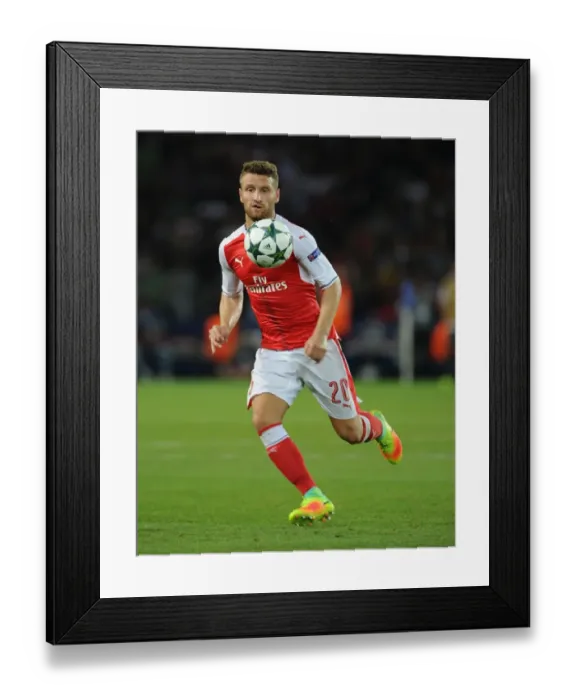Framed Print : Mustafi in Action: Arsenal vs. Paris Saint-Germain, UEFA Champions League 2016-17
