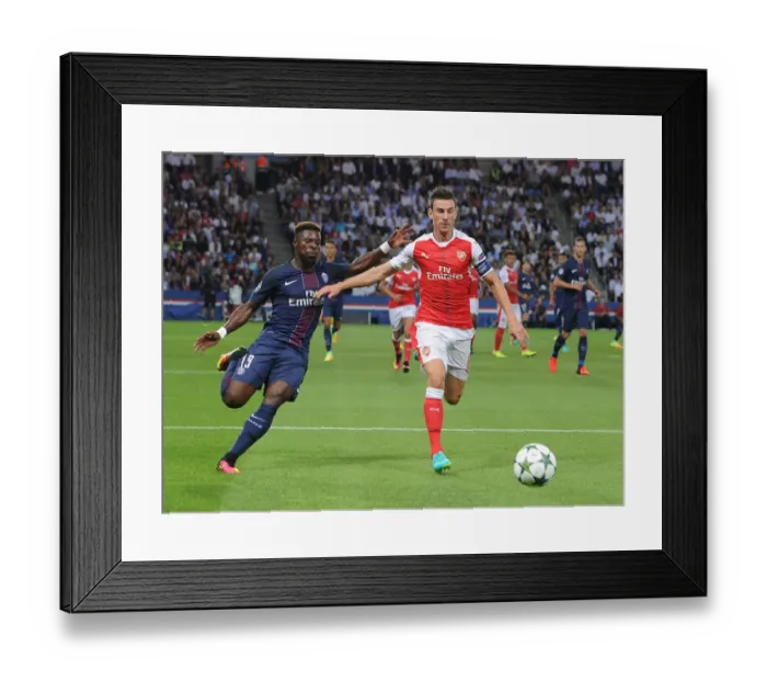Framed Print : Clash of Titans: Koscielny vs. Aurier - Paris Saint-Germain vs. Arsenal UEFA Champions League Showdown