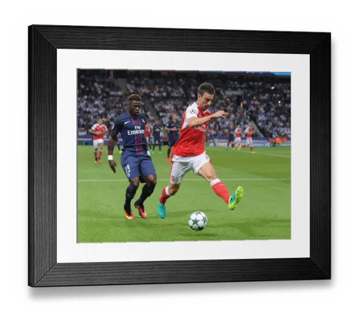 Framed Print : Clash of Titans: Koscielny vs. Aurier - Paris Saint-Germain vs. Arsenal UCL Showdown Framed Print : Clash of Titans: Koscielny vs. Aurier - Paris Saint-Germain vs. Arsenal UCL Showdown