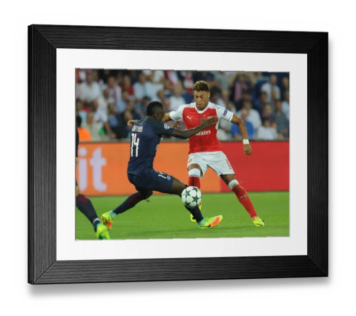Framed Print : Champions League Showdown: Oxlade-Chamberlain vs. Matuidi - Arsenal's Battle at Parc des Princes (2016-17): A Clash of Midfield Titans