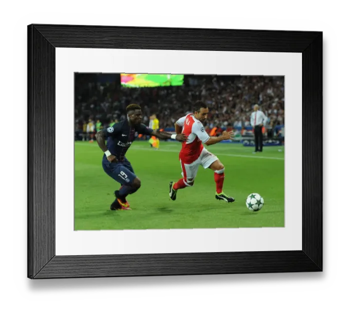 Framed Print : Champions League Showdown: Cazorla vs. Aurier - Paris Saint-Germain vs. Arsenal (2016-17): A Clash of Stars