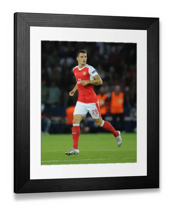 Framed Print : Granit Xhaka: Arsenal's Midfield Maestro in Action against Paris Saint-Germain, UEFA Champions League 2016-17 Framed Print : Granit Xhaka: Arsenal's Midfield Maestro in Action against Paris Saint-Germain, UEFA Champions League 2016-17