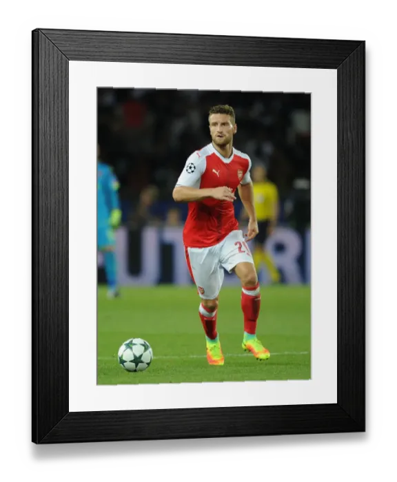 Framed Print : Mustafi in Action: Arsenal vs. Paris Saint-Germain, UEFA Champions League 2016-17