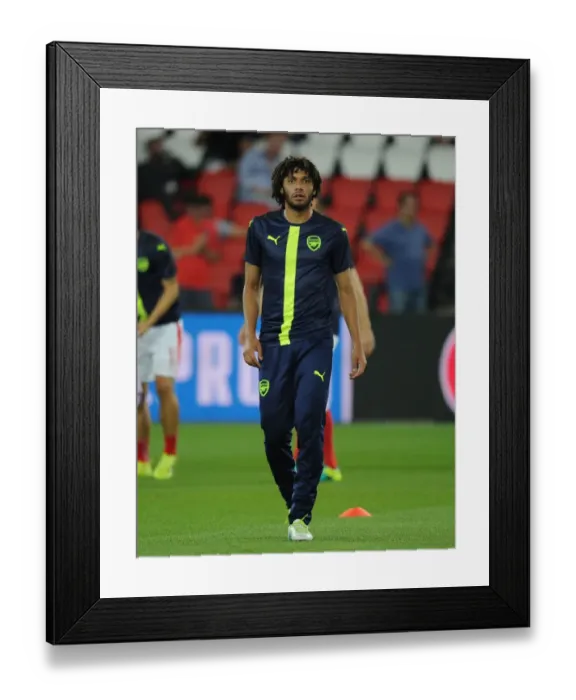 Framed Print : Arsenal's Mohamed Elneny Readies for Paris Saint-Germain Showdown in UEFA Champions League (2016-17) Framed Print : Arsenal's Mohamed Elneny Readies for Paris Saint-Germain Showdown in UEFA Champions League (2016-17)