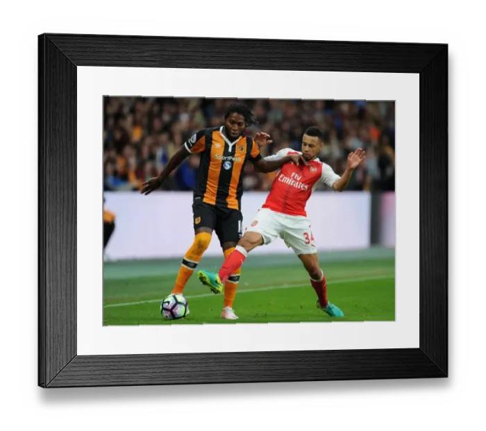 Framed Print : Coquelin vs Mbokani: A Premier League Battle at Hull City