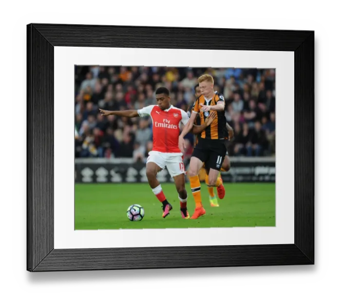Framed Print : Arsenal's Alex Iwobi vs. Hull's Sam Clucas: A Premier League Battle Framed Print : Arsenal's Alex Iwobi vs. Hull's Sam Clucas: A Premier League Battle