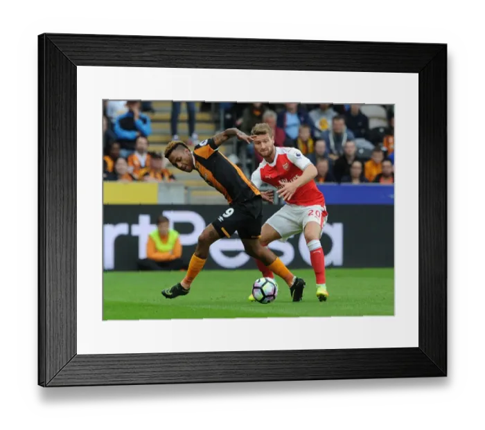 Framed Print : Mustafi vs Hernandez: A Premier League Battle at KCOM Stadium Framed Print : Mustafi vs Hernandez: A Premier League Battle at KCOM Stadium