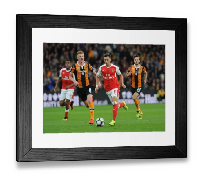 Framed Print : Mesut Ozil vs Sam Clucas: A Premier League Showdown at KCOM Stadium