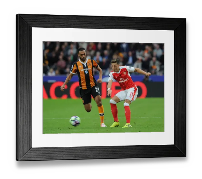 Framed Print : Mesut Ozil vs. Ahmed Elmohamady: A Premier League Showdown at KCOM Stadium