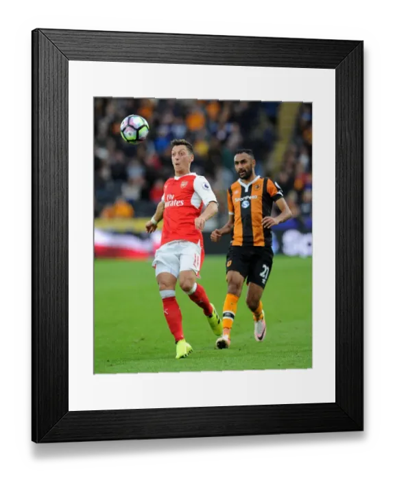 Framed Print : Mesut Ozil vs Ahmed Elmohamady: Intense Face-Off in Hull City vs Arsenal, Premier League 2016-17