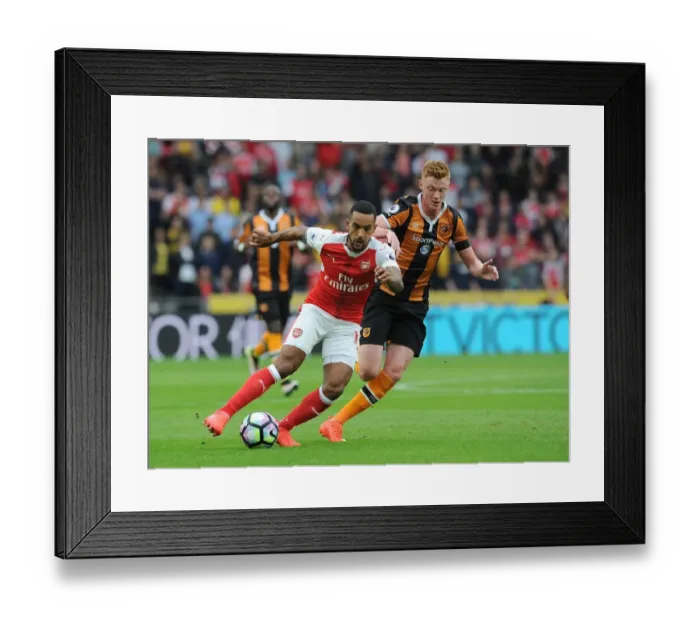 Framed Print : Theo Walcott vs. Sam Clucas: A Premier League Battle at KCOM Stadium