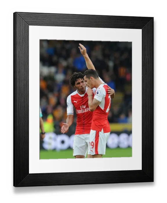 Framed Print : Xhaka and Elneny's Jubilant Moment: Arsenal's Four-Goal Surge Against Hull City