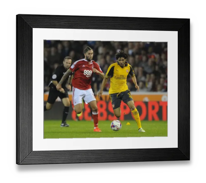Framed Print : Mohamed Elneny vs. Henri Lansbury: A Battle in the EFL Cup Third Round between Nottingham Forest and Arsenal, 2016-17