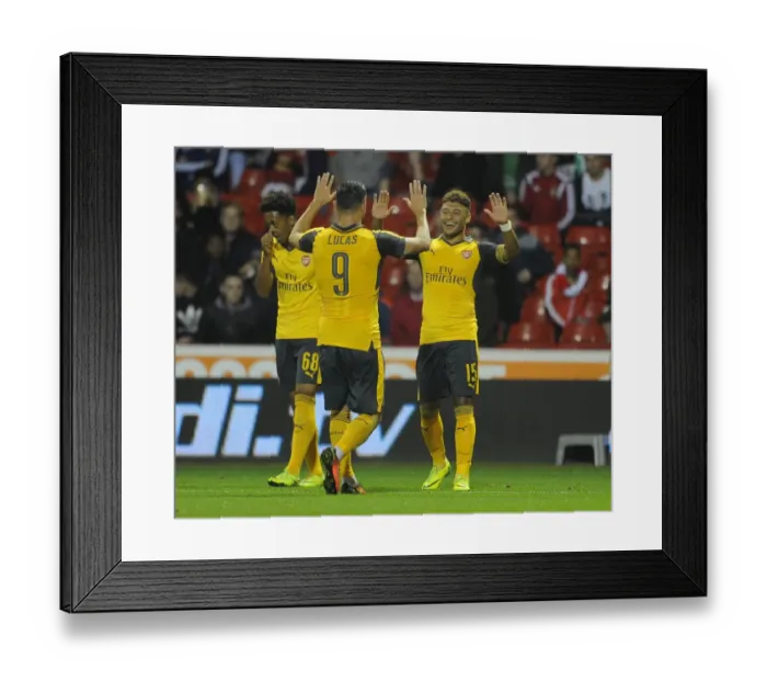 Framed Print : Arsenal's Oxlade-Chamberlain and Perez Celebrate Goals in EFL Cup Victory over Nottingham Forest Framed Print : Arsenal's Oxlade-Chamberlain and Perez Celebrate Goals in EFL Cup Victory over Nottingham Forest