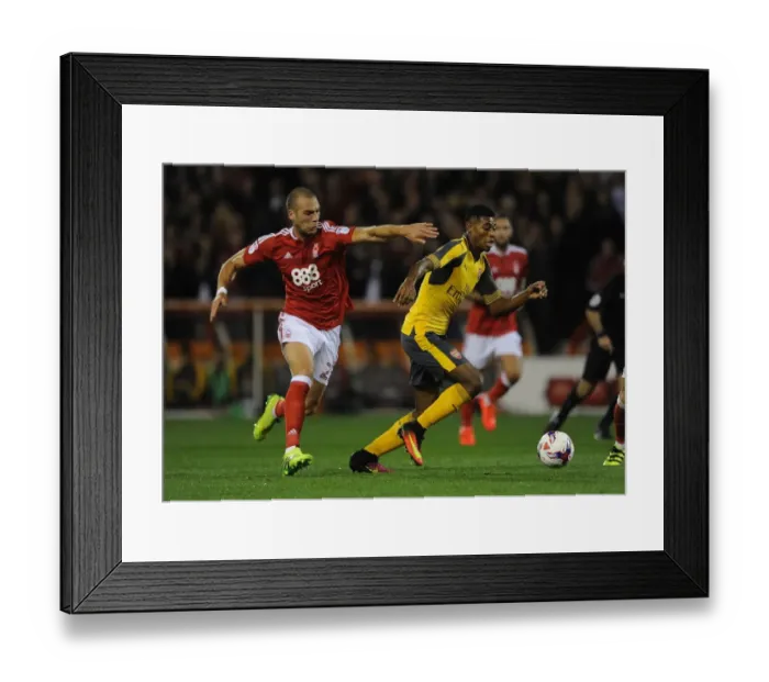 Framed Print : Reine-Adelaide vs. Kasami: A Battle in the EFL Cup Third Round between Nottingham Forest and Arsenal