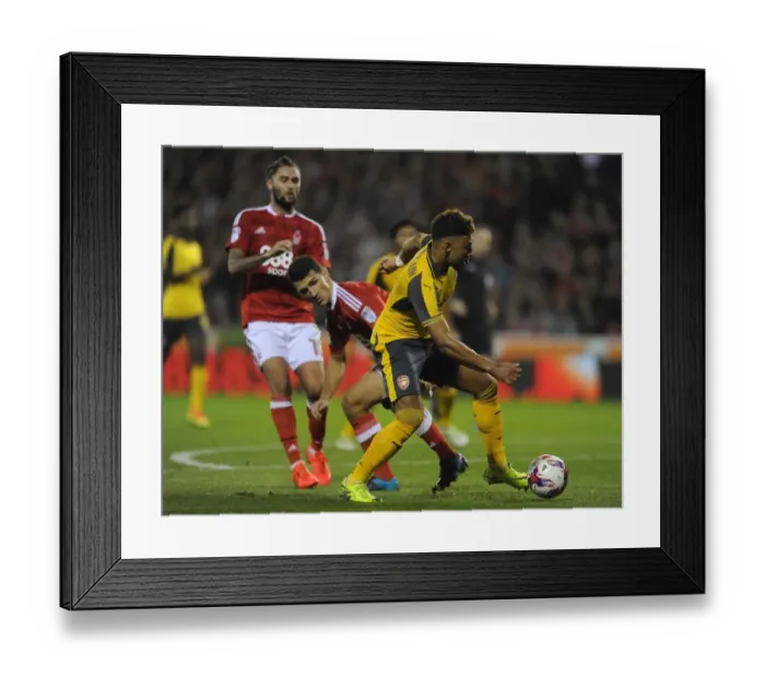 Framed Print : Alex Oxlade-Chamberlain (Arsenal) Eric Lichaj (Forest). Nottingham Forest 0: 4 Arsenal Framed Print : Alex Oxlade-Chamberlain (Arsenal) Eric Lichaj (Forest). Nottingham Forest 0: 4 Arsenal