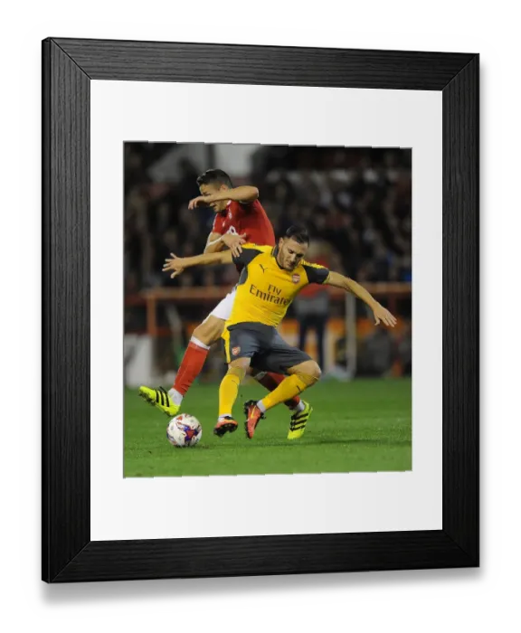 Framed Print : Lucas Perez (Arsenal) Chris Cohen (Forest). Nottingham Forest 0: 4 Arsenal. EPL League Cup